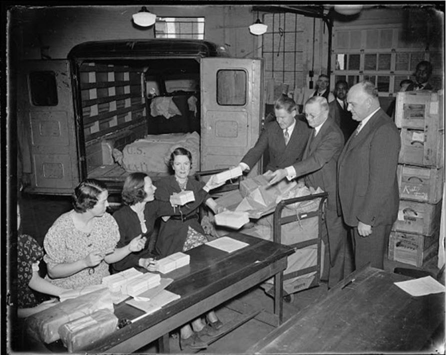 Photos of employees and supervisors processing the 1937 unemployment census
